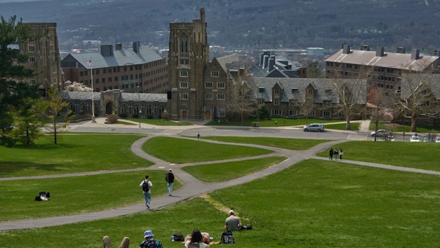 Students on Libe Slope at the Cornell University campus in Ithaca, US, on Tuesday, April 11, 2023. US college costs just keep climbing and the increase is pushing the annual price for the upcoming academic year at Ivy League schools toward yet another hold-on-to-your-mortarboard mark. Photographer: Bing Guan/Bloomberg via Getty Images
