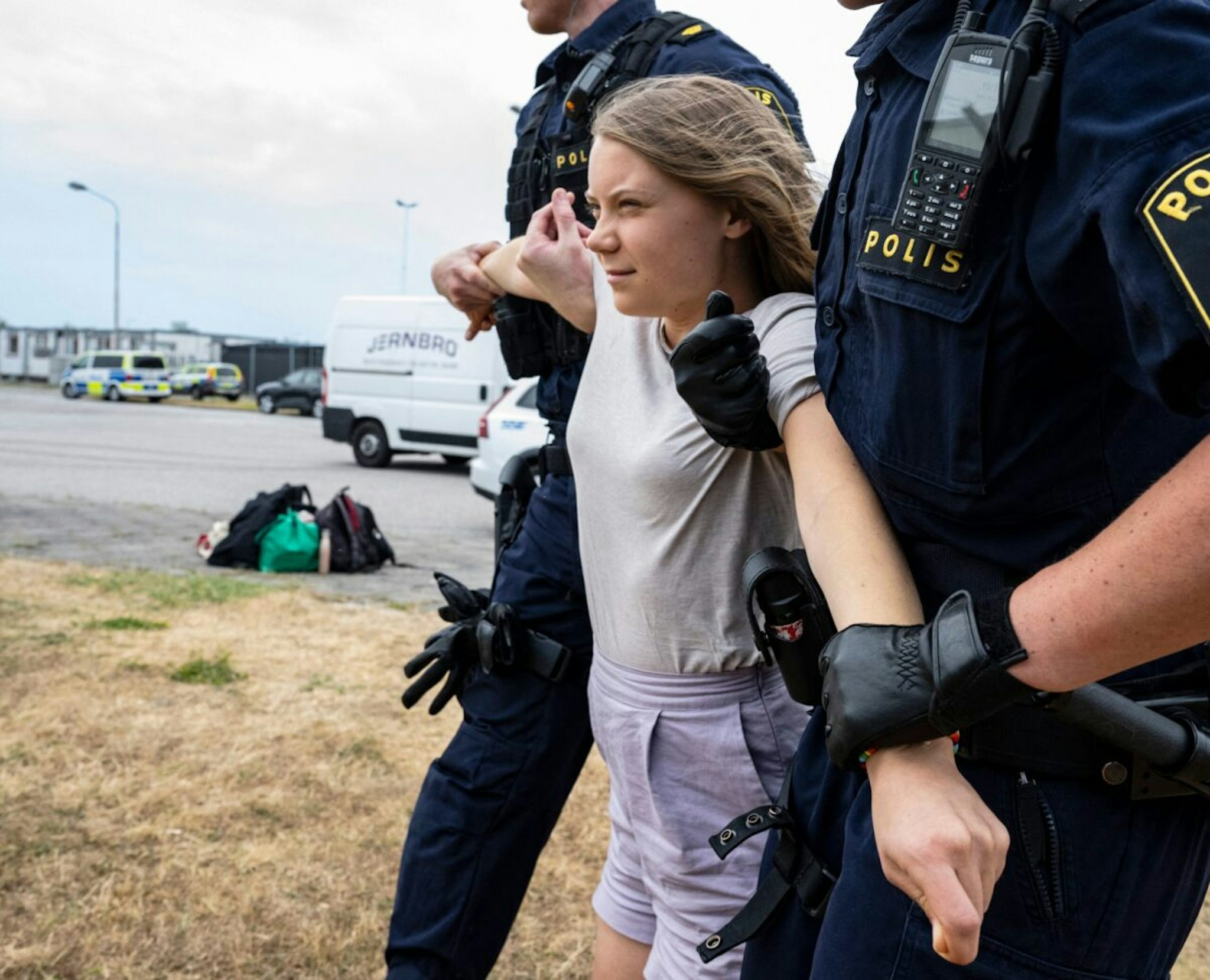 Police officers carry Swedish climate activist Greta Thunberg away together with other climate activists from the organization 'Ta Tillbaka Framtiden' (Take Back the Future), who block the entrance to Oljehamnen neighbourhood in Malmo, Sweden, on June 19, 2023, for the 5th day in a row.