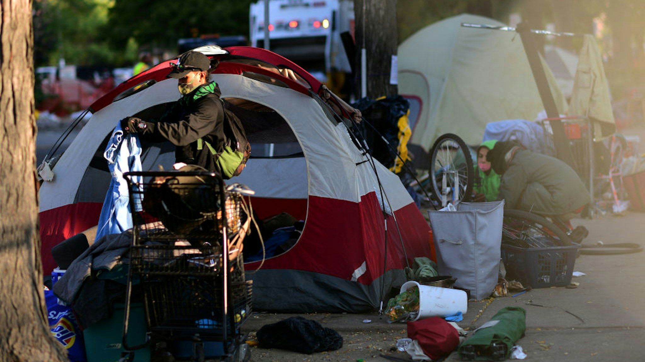 DENVER, CO - OCTOBER 6 : People start packing their belongings near the intersection of 13th Ave. and Logan St. in Denver, Colorado on Tuesday. October 6, 2020. Denver city crews swept the tents of encampment site. (Photo by Hyoung Chang/MediaNews Group/The Denver Post via Getty Images)