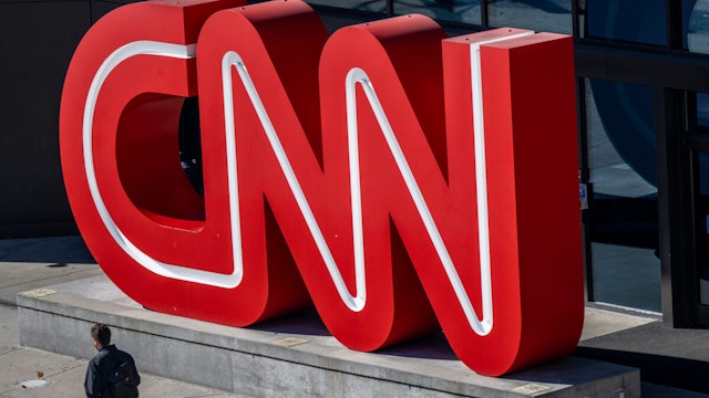 ATLANTA, GEORGIA - NOVEMBER 17: A person walks past the headquarters of the Cable News Network (CNN) on November 17, 2022 in Atlanta, Georgia. CNN's CEO and Chairman, Chris Licht, has confirmed that the company will begin layoffs in early December.