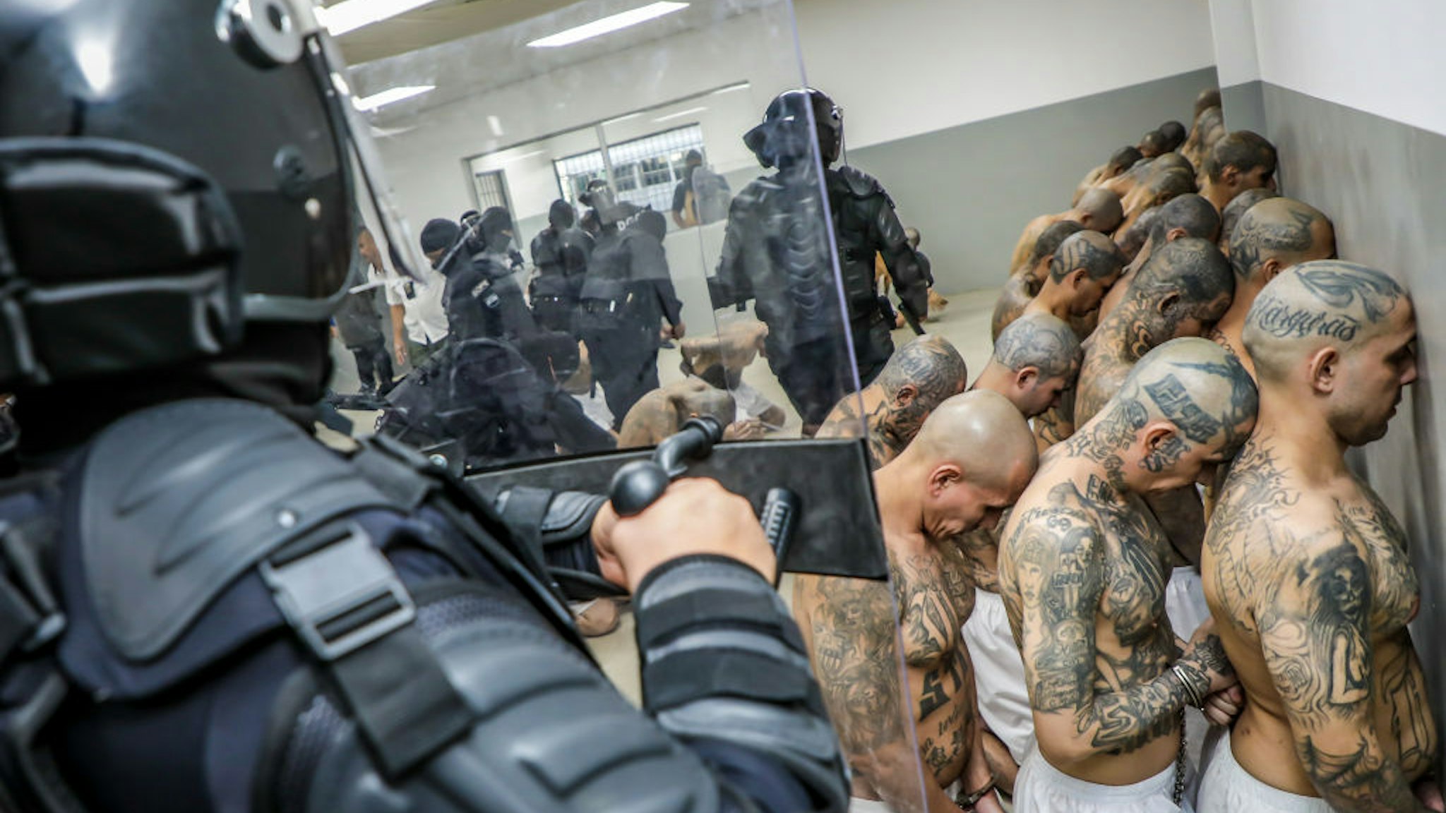 TECOLUCA, EL SALVADOR - FEBRUARY 24: A first group of 2,000 detainees are moved to the mega- prison Terrorist Confinement Centre (CECOT) on February 24, 2023 in Tecoluca, El Salvador. Since president Nayib Bukele announced state of exception in March 2022, over 62,000 suspected gang members have been arrested. Human Rights organizations denounce abuses and due process violations. El Salvador has one of highest crime rates in Latin America. (Photo by Presidencia El Salvador via Getty Images )