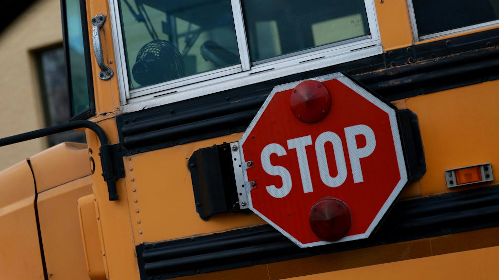 MIAMI, FLORIDA - APRIL 19: A stop sign attached to a school bus is shown on April 19, 2023 in Miami, Florida. The Florida Board of Education today approved banning discussion in the classroom of sexual orientation and gender identity for all grades through 12th grade, an expansion of what critics call the “Don’t Say Gay” law. (Photo by Joe Raedle/Getty Images)