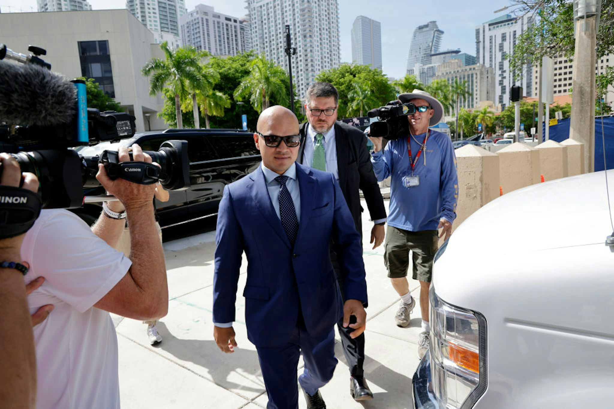 MIAMI, FLORIDA - JULY 6: Walt Nauta, valet to former U.S. President Donald Trump and a co-defendant in federal charges filed against Trump, arrives with Lawyer, Stanley Woodward, at the James Lawrence King Federal Justice Building on July 6, 2023 in Miami, Florida. The arraignment for Walt Nauta, charged alongside former President Donald Trump for allegedly mishandling classified documents, was postponed and rescheduled for July 6. It was postponed due to Nauta's inability to find a Florida-based attorney and being stuck in Newark, NJ, after his flight was canceled.