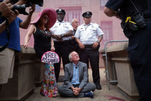 WASHINGTON, DC - JULY 06: Ben Cohen, co-founder of Ben & Jerry’s ice cream, refuses to leave an entrance outside the Department of Justice before being arrested July 6, 2023 in Washington, DC. Cohen was arrested after protesting the Department of Justice’s prosecution of Wikileaks publisher Julian Assange. (Photo by Win McNamee/Getty Images)