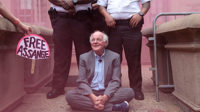 WASHINGTON, DC - JULY 06: As a pink smoke bomb clouds the air, Ben Cohen, co-founder of Ben &amp; Jerry’s ice cream, refuses to leave an entrance outside the Department of Justice before being arrested July 6, 2023 in Washington, DC. Cohen was arrested after protesting the Department of Justice’s prosecution of Wikileaks publisher Julian Assange. (Photo by Win McNamee/Getty Images)