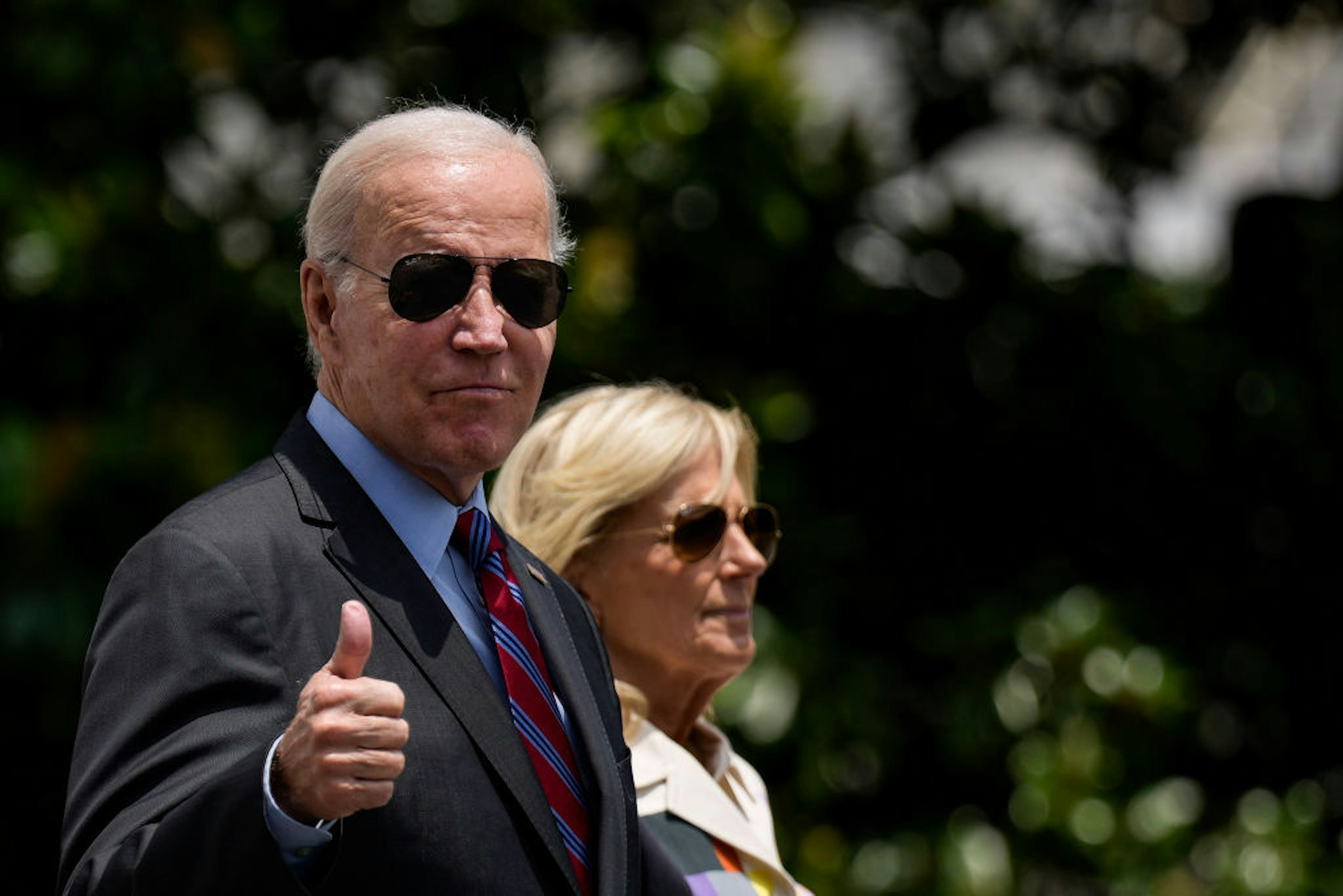 WASHINGTON, DC - JULY 14: U.S. President Joe Biden gives a thumbs up as he walks with first lady Jill Biden to Marine One on the South Lawn of the White House July 14, 2023 in Washington, DC. Biden is spending the weekend at Camp David in Maryland. (Photo by Drew Angerer/Getty Images)
