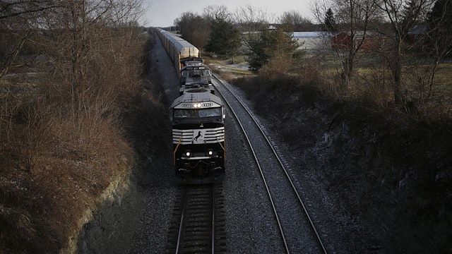 WADDY, KY - JANUARY 5: A westbound Norfolk Southern Corp. freight train makes its way along the tracks January 6, 2014 in Waddy, Kentucky. Intermodal rail traffic in the United States increased 10.6% in the last week of 2013 compared to the same week in 2012 according to a report from the Association of American Railroads. Volumes rose due in part to demand from retailers restocking store shelves and distribution centers following the holiday retail crush. (Photo by Luke Sharrett/Getty Images)