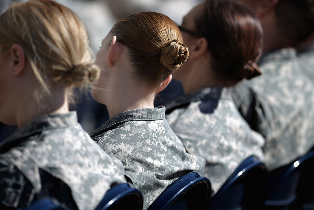 Female recruit considered resigning after being made to shower with two transgender men, says senator.