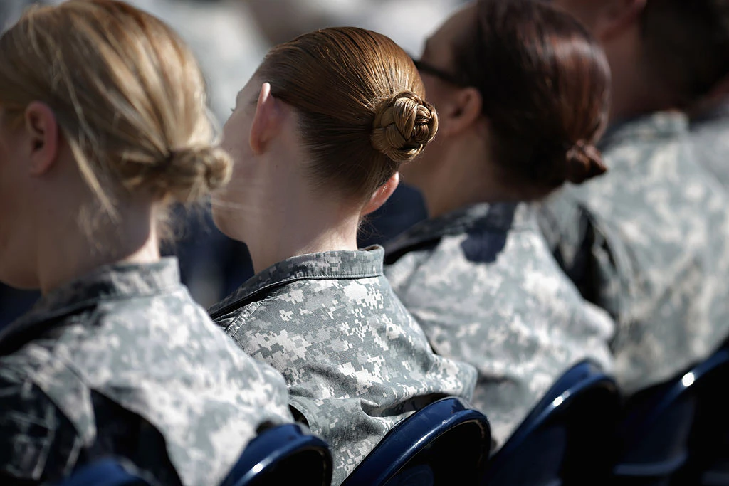 ARLINGTON, VA - MARCH 31: Soldiers, officers and civilian employees attend the commencement ceremony for the U.S. Army's annual observance of Sexual Assault Awareness and Prevention Month in the Pentagon Center Courtyard March 31, 2015 in Arlington, Virginia. In conjunction with the national campaign against sexual assault, The Army announced this year's theme, 'Not in My Squad. Not in Our Army. We are Trusted Professionals,' during the ceremony.Ê According to the Pentagon, the initative 'is a grassroots approach meant to reinforce a climate of dignity and respect founded on good order and discipline.' (Photo by Chip Somodevilla/Getty Images)