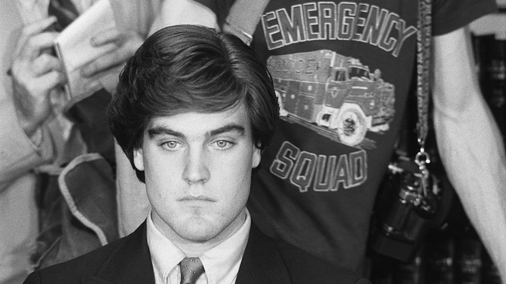 Robert Chambers, the accused in the so-called "Preppy Murder", eventually pleaded guilty to first-degree manslaughter. He insisted that he had unintentionally strangled Levin during rough sex while in Central Park, where her body was found. Here he faces reporters after being released from the Riker's Island jail on $150,000 bond. 1986.