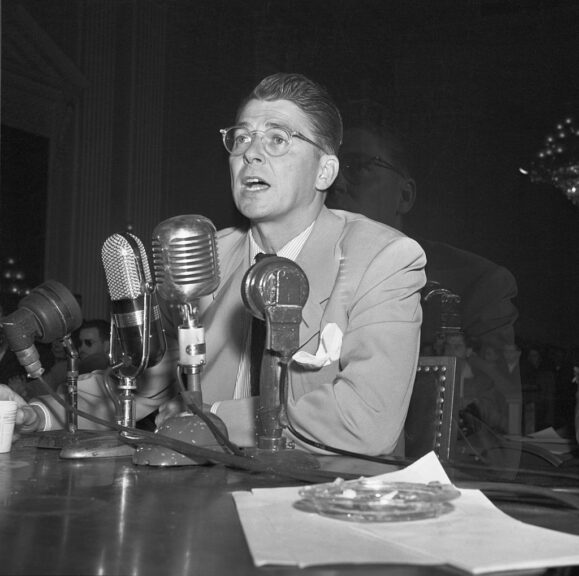 Movie actor Ronald Reagan testifies before the House Un-American Activities Committee.