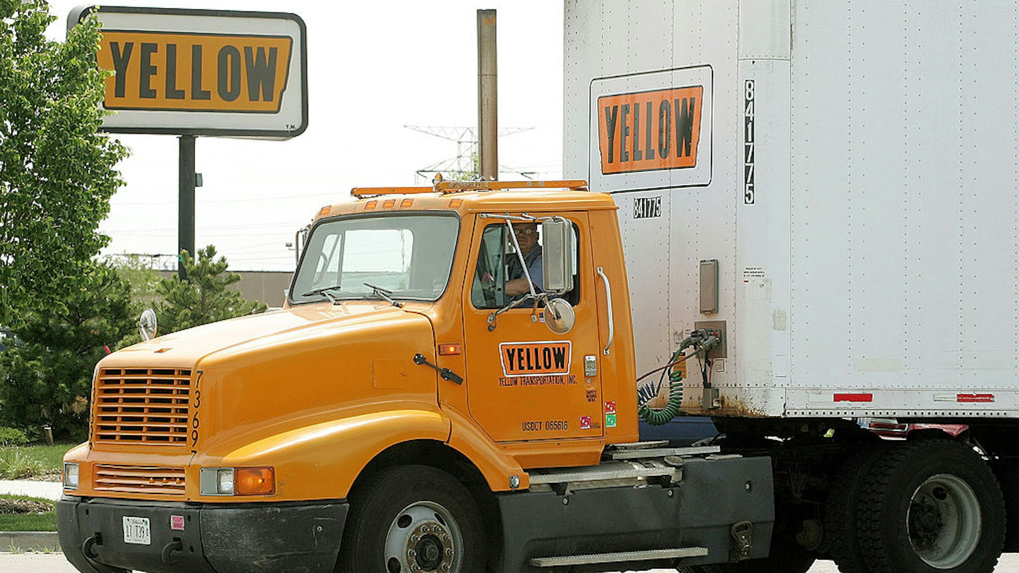 WHEELING, IL - MAY 25: A Yellow truck leaves the truck terminal May 25, 2005 in Wheeling, Illinois. In a $1.37 billion deal, Overland Park, Kansas-based Yellow Roadway has acquired Chicago-based USF Corporation. Yellow Roadway's workers will now number close to 70,000 with a $9 billion annual revenue.