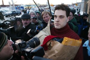 UNITED STATES - FEBRUARY 14: Robert Chambers, wearing a red sweater on a chilly Valentine's Day and clutching a paper bag, brushes past reporters and cameras upon his release from Auburn Correctional Facility this morning. Chambers, the so-called "Preppie Killer," served 15 years for the murder of 18-year-old Jennifer Levin in Central Park on Aug. 26, 1986. (Photo by Corey Sipkin/NY Daily News Archive via Getty Images)