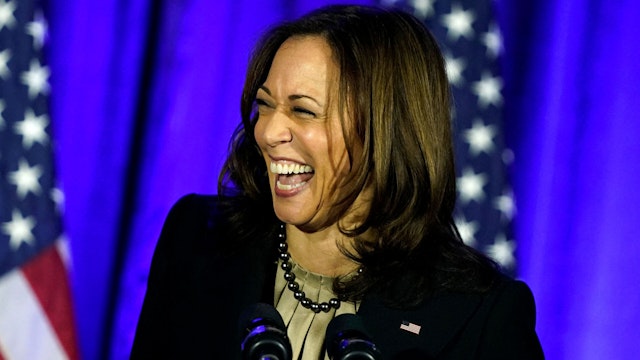 US Vice President Kamala Harris laughs as she speaks during a holiday reception for the Democratic National Committee at Hotel Washington, in Washington, DC, on December 14, 2021.