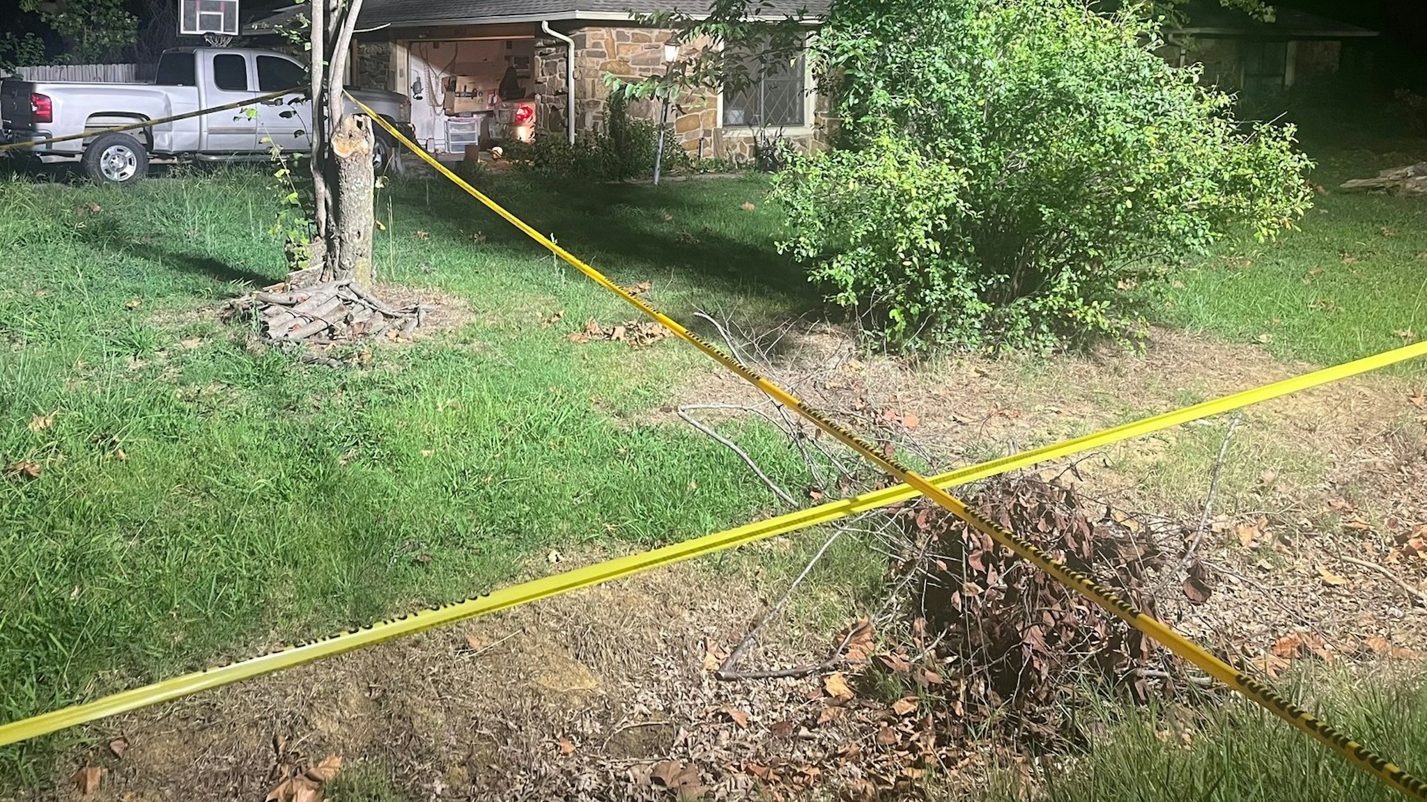 Police tape outside the home of Brandy McCaslin, 39, who murdered her three young children before turning the gun on herself.