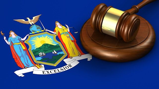 New York US state law, code, legal system and justice concept with a 3d render of a gavel on the New Yorker flag on background.