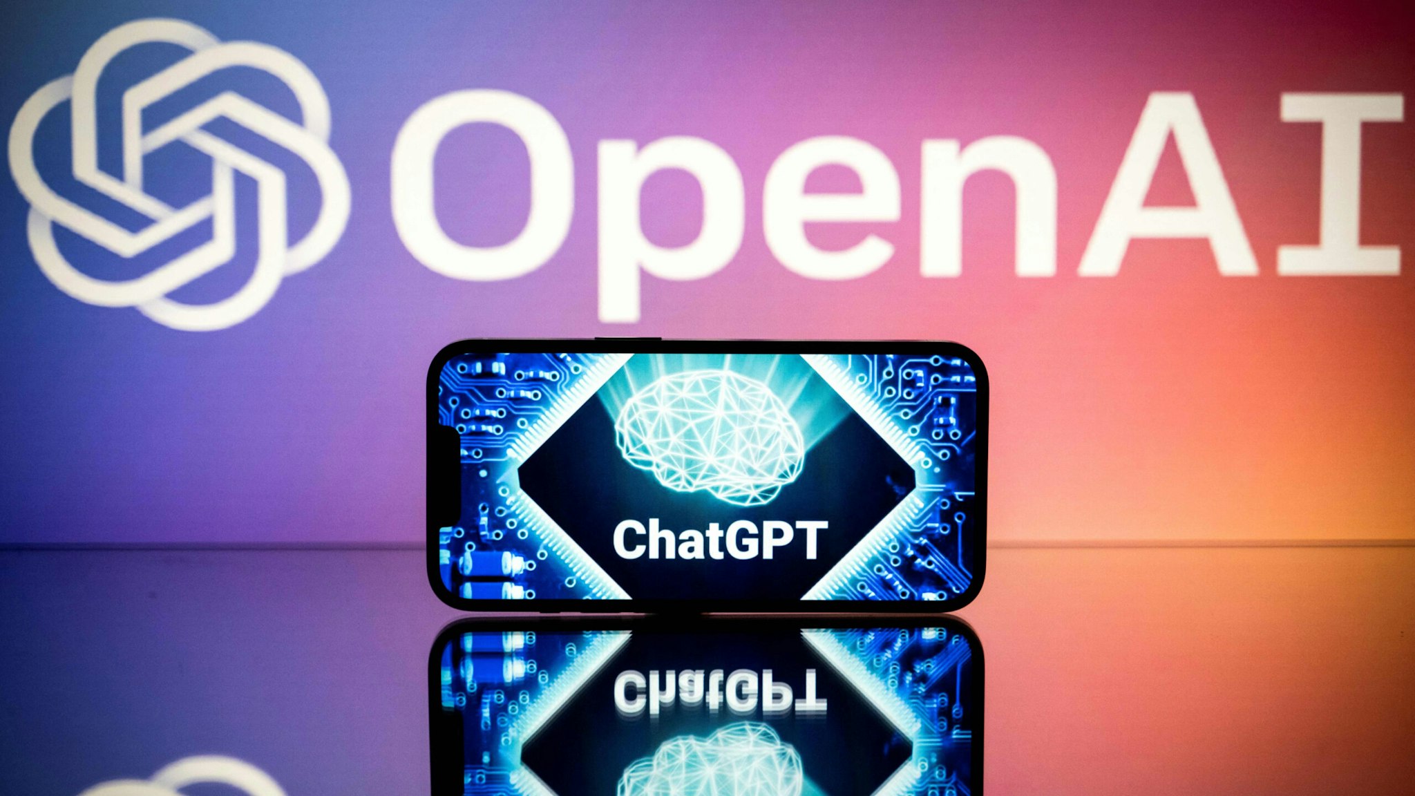 This picture taken on January 23, 2023 in Toulouse, southwestern France, shows screens displaying the logos of OpenAI and ChatGPT. - ChatGPT is a conversational artificial intelligence software application developed by OpenAI.