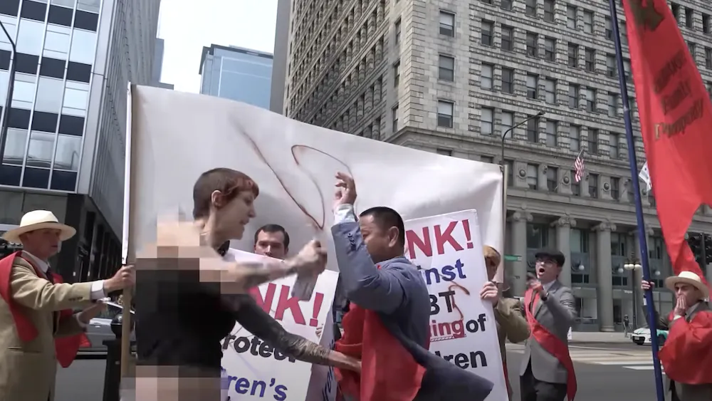 WATCH: Catholic Group Protesting Drag Queen Story Hour Attacked, Hit With Spray Paint