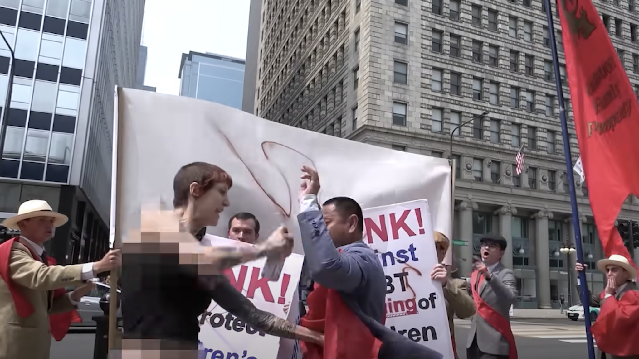 Screenshot/YouTube: TFP Student Action — LGBT Advocates Attack Peaceful Pro-Family Event: "Paint hit me in the eyes"