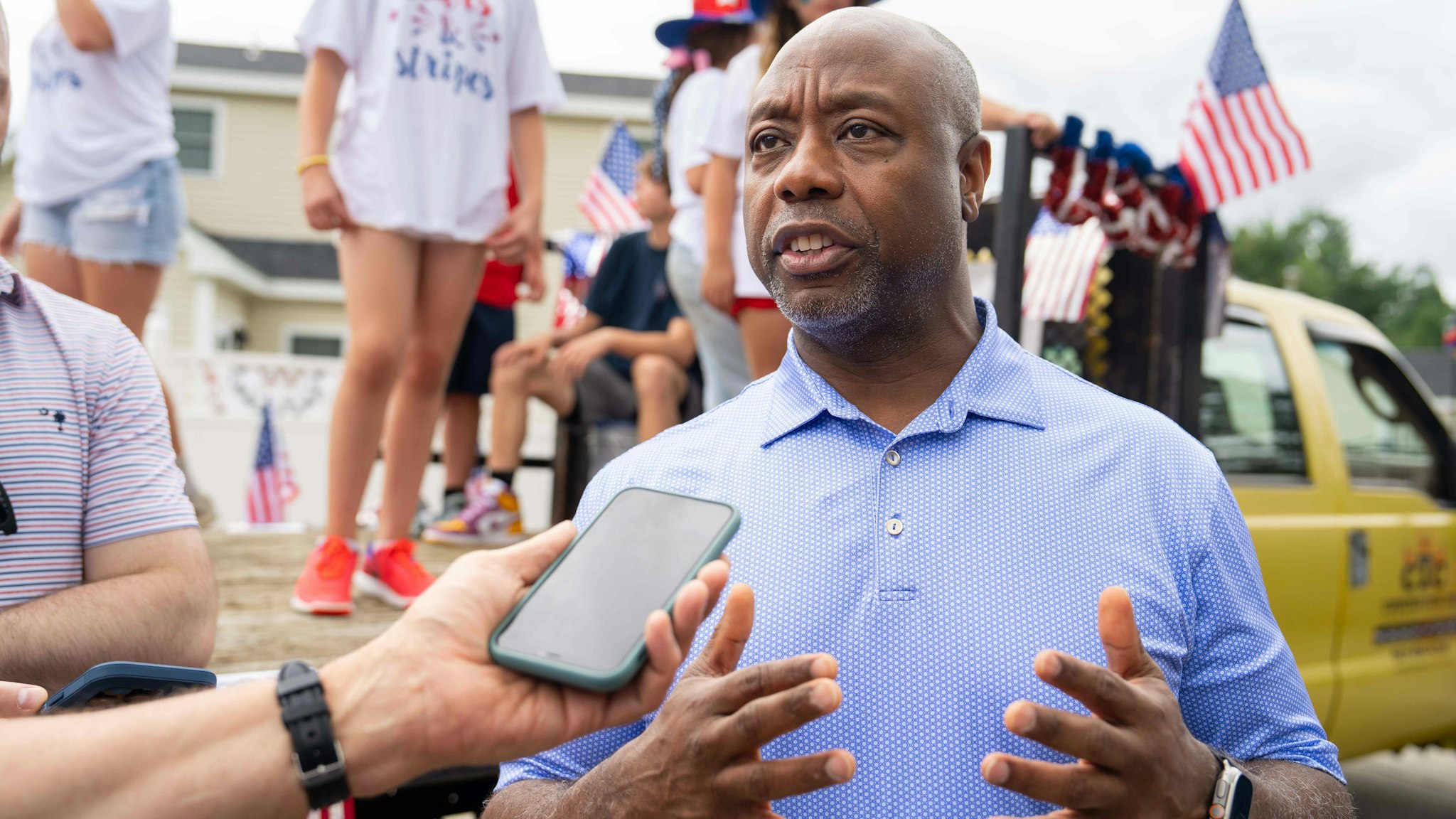 Senator Tim Scott, a Republican from South Carolina, attends the Independence Day parade in Merrimack, New Hampshire, US, on Tuesday, July 4, 2023. Republican presidential candidates face an early test this month of whether they can raise enough money to sustain their campaigns through party primaries and break away from a growing GOP field.