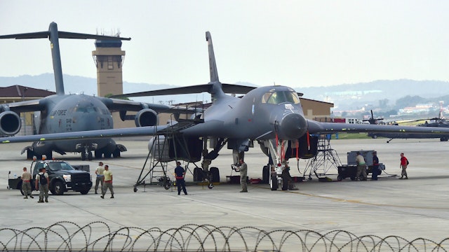US Air Force B-1B Lancer strategic bomber (R) and C-17 Globemaster cargo jet (L) are displayed during "Air Power Day" preview at US Osan Air Base in Pyeongtaek on September 23, 2016. An American strategic bomber arrived in South Korea on September 21 in a show of force the US said was aimed at reminding Pyongyang of its powerful military assets in the region. The event will be held for two days from on September 24.
