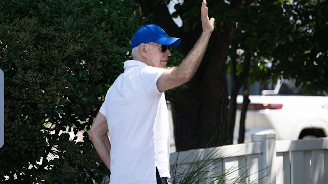 US President Joe Biden walks to the beach from his home in Rehoboth Beach, Delaware, July 8, 2023, as he spends the weekend at his vacation home.