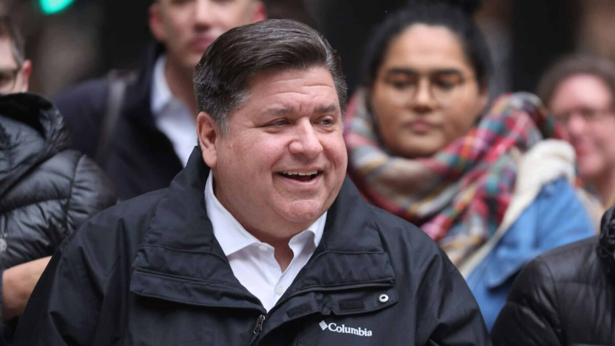 Illinois Gov. J.B. Pritzker listens to speakers during a transgender support rally at Federal Building Plaza on April 27, 2022 in Chicago, Illinois.