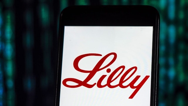 In this photo illustration, the Eli Lilly and Company, Pharmaceutical company logo seen displayed on a smartphone.