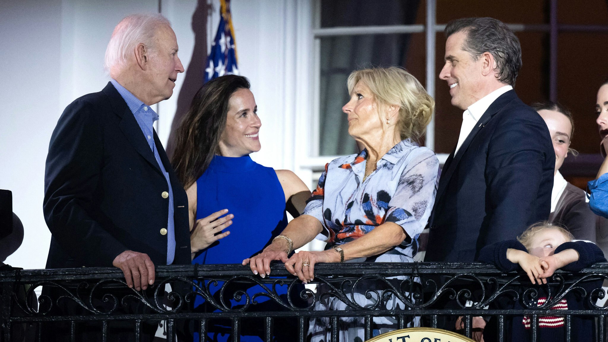 US President Joe Biden, First Lady Jill Biden alongside Hunter Biden (R) and Ashley Biden (2L) watch the Independence Day fireworks display from the Truman Balcony of the White House in Washington, DC, on July 4, 2023.
