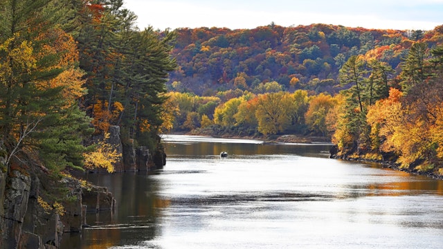 River and cliffs with vibrant fall colors. Interstate State Park. Taylors Falls, MN.