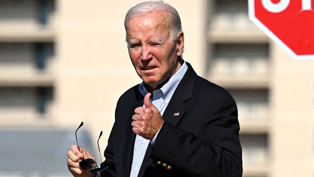 US President Joe Biden gives a thumbs up as he leaves St. Edmond Roman Catholic Church in Rehoboth Beach, Delaware, after being asked if he spoke US Senate Minority Leader Mitch McConnell, Republican of Kentucky, on July 29, 2023. Biden was asked how McConnell is doing; the president gave th thumbs up.