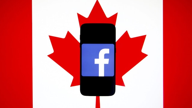 Facebook logo is displayed on a mobile phone screen photographed on Cabada national flag background arranged for illustration photo taken in Krakow, Poland on 15th January, 2020.