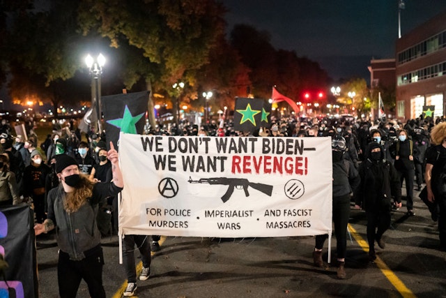 PORTLAND, OR - NOVEMBER 04: A black bloc crowd marches along the waterfront on November 4, 2020 in Portland, Oregon. Multiple protests, some peaceful and others violent, broke out in Portland as the presidential election remained undecided. (Photo by Nathan Howard/Getty Images)