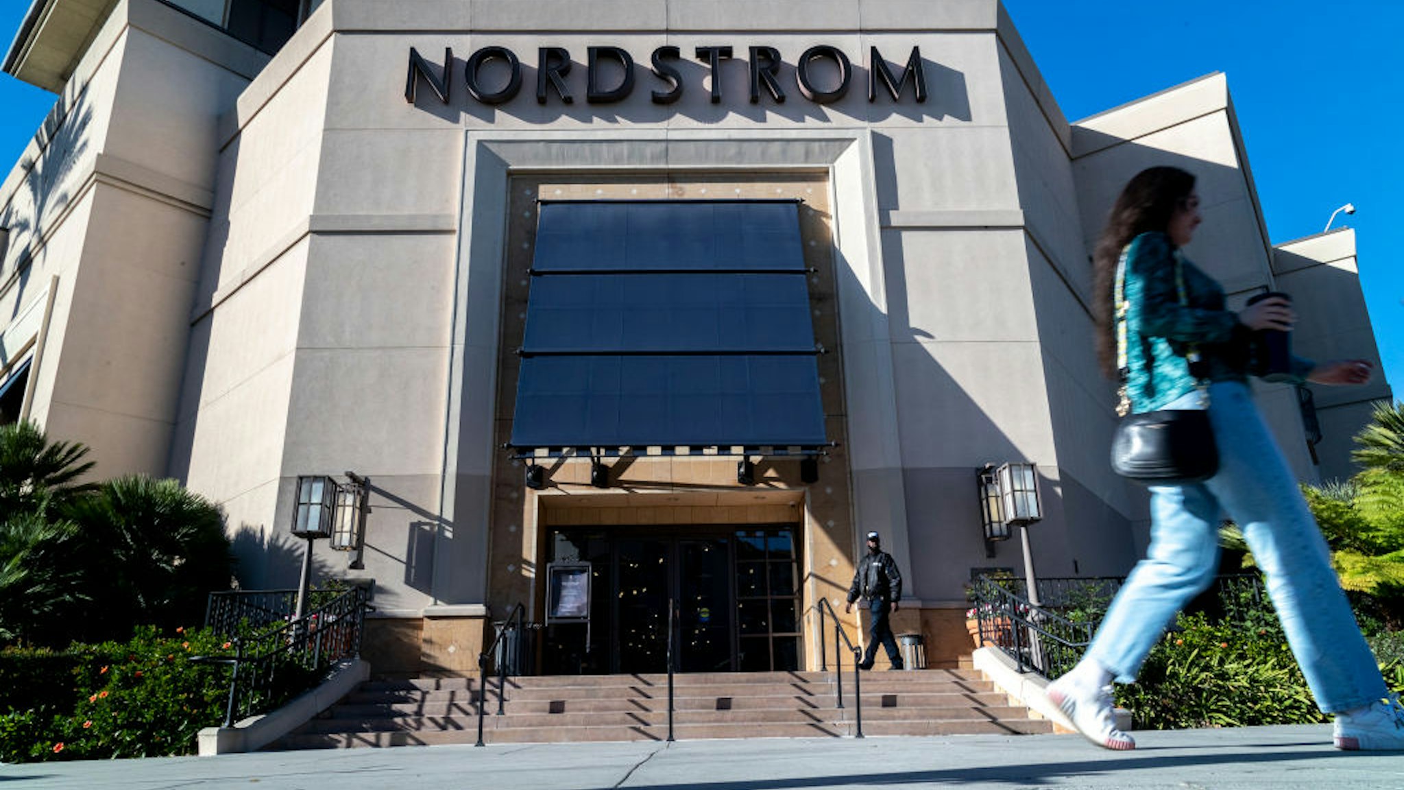 LOS ANGELES, CA - NOVEMBER 23, 2021: A security guard patrols the front entrance of Nordstrom on Tuesday after an organized group of thieves attempted a smash-and-grab robbery late Monday night at The Grove location November 23, 20201 in Los Angeles, California. (Gina Ferazzi / Los Angeles Times via Getty Images)