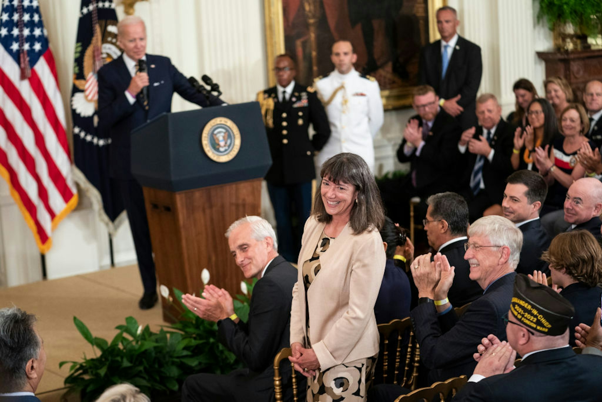 WASHINGTON, UNITED STATES - AUG 10: Monica Bertagnolli, newly appointed director of the National Cancer Institute, stands for recognition during remarks by President Joe Biden before signing S. 3373, the Sergeant First Class Heath Robinson Honoring our Promises to Address Comprehensive Toxics (PACT) Act of 2022, into law in the East Room of the White House in Washington, D.C., on Wednesday Aug. 10, 2022. (