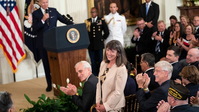 WASHINGTON, UNITED STATES - AUG 10: Monica Bertagnolli, newly appointed director of the National Cancer Institute, stands for recognition during remarks by President Joe Biden before signing S. 3373, the Sergeant First Class Heath Robinson Honoring our Promises to Address Comprehensive Toxics (PACT) Act of 2022, into law in the East Room of the White House in Washington, D.C., on Wednesday Aug. 10, 2022. (