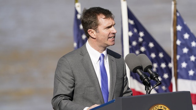 Andy Beshear, governor of Kentucky, speaks during an event in Covington, Kentucky, US, on Wednesday, Jan. 4, 2023. President Biden spoke about the 2021 Bipartisan Infrastructure Law and the bills $1.6 billion used for repairs to the 60-year-old Brent Spence Bridge, which connects a span of Interstate 75 over the Ohio River into Cincinnati.
