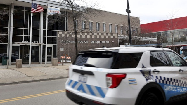 A Chicago police vehicle passes the 18th District station at 1160 N. Larrabee Ave. on Feb. 15, 2023.