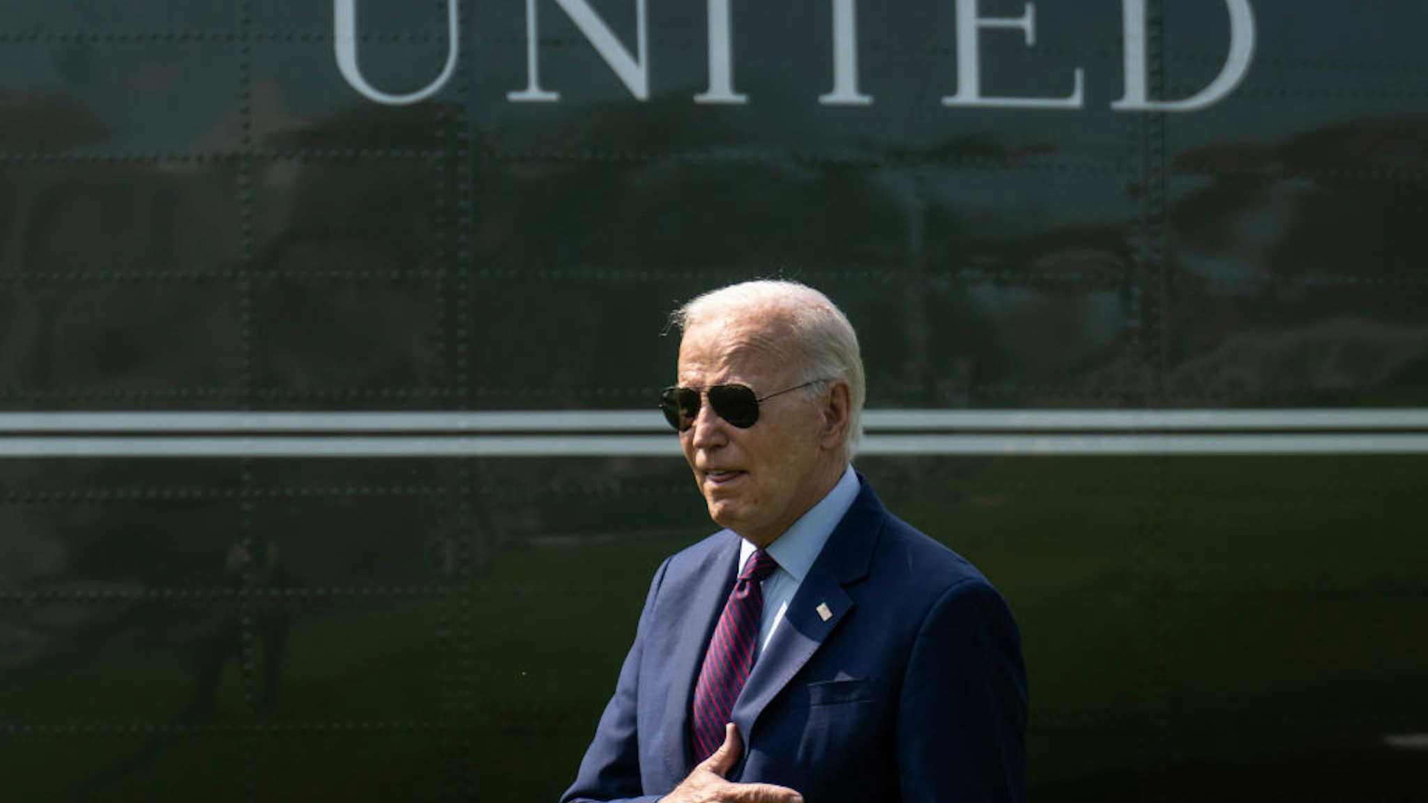 WASHINGTON, DC - JULY 28: U.S. President Joe Biden gestures toward visitors watching the departure as he walks to Marine One on the South Lawn of the White House July 28, 2023 in Washington, DC. President Biden is traveling to Auburn, Maine to discuss manufacturing and his "Bidenomics" economic plan.