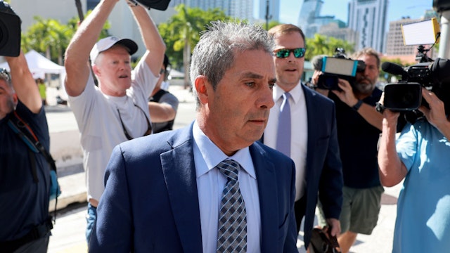 MIAMI, FLORIDA - JULY 31: Carlos De Oliveira (L), a property manager for former U.S. President Donald Trump's Mar-a-Lago estate, arrives with his lawyer John Irving at the James Lawrence King Federal Justice Building on July 31, 2023 in Miami, Florida. Special counsel Jack Smith announced three new felony charges against Trump, including claims that he asked De Oliveira to delete security camera footage of his Mar-a-Lago home that was being sought by investigators probing his handling of classified documents.