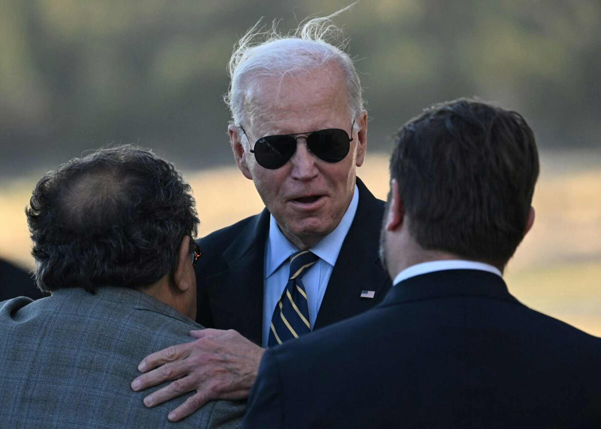US President Joe Biden is greeted as he arrives at Grand Canyon National Park Airport in Grand Canyon Village, Arizona, on August 7, 2023.