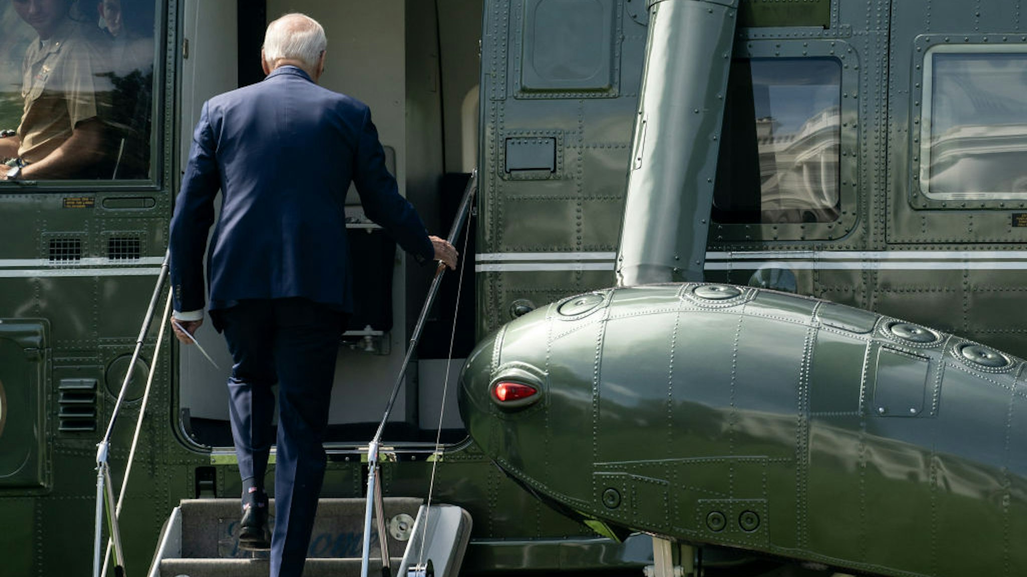 US President Joe Biden boards Marine One on the South Lawn of the White House in Washington, DC, US, on Tuesday, Aug. 15, 2023. Biden, speaking in Wisconsin today, is leading an administration-wide effort to mark the one-year anniversary of the Democrats landmark climate and drug pricing legislation whose implementation officials are counting on to fuel the presidents reelection bid. Photographer: Nathan Howard/Bloomberg via Getty Images