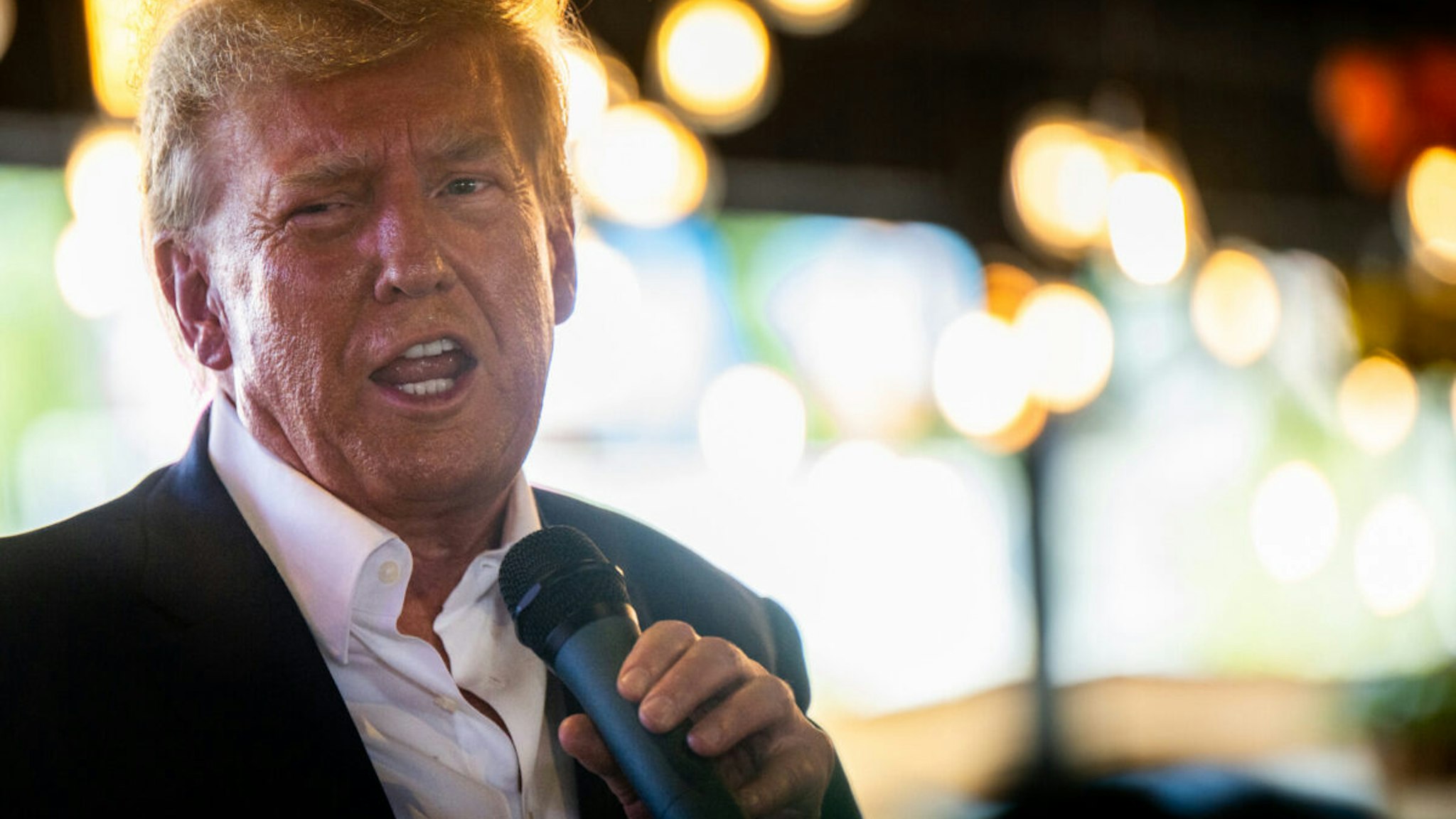 Republican presidential candidate and former U.S. President Donald Trump speaks during a rally at the Steer N' Stein bar at the Iowa State Fair on August 12, 2023 in Des Moines, Iowa. Republican and Democratic presidential hopefuls, including Florida Gov. Ron DeSantis, former President Donald Trump are visiting the fair, a tradition in one of the first states to hold caucuses in 2024.
