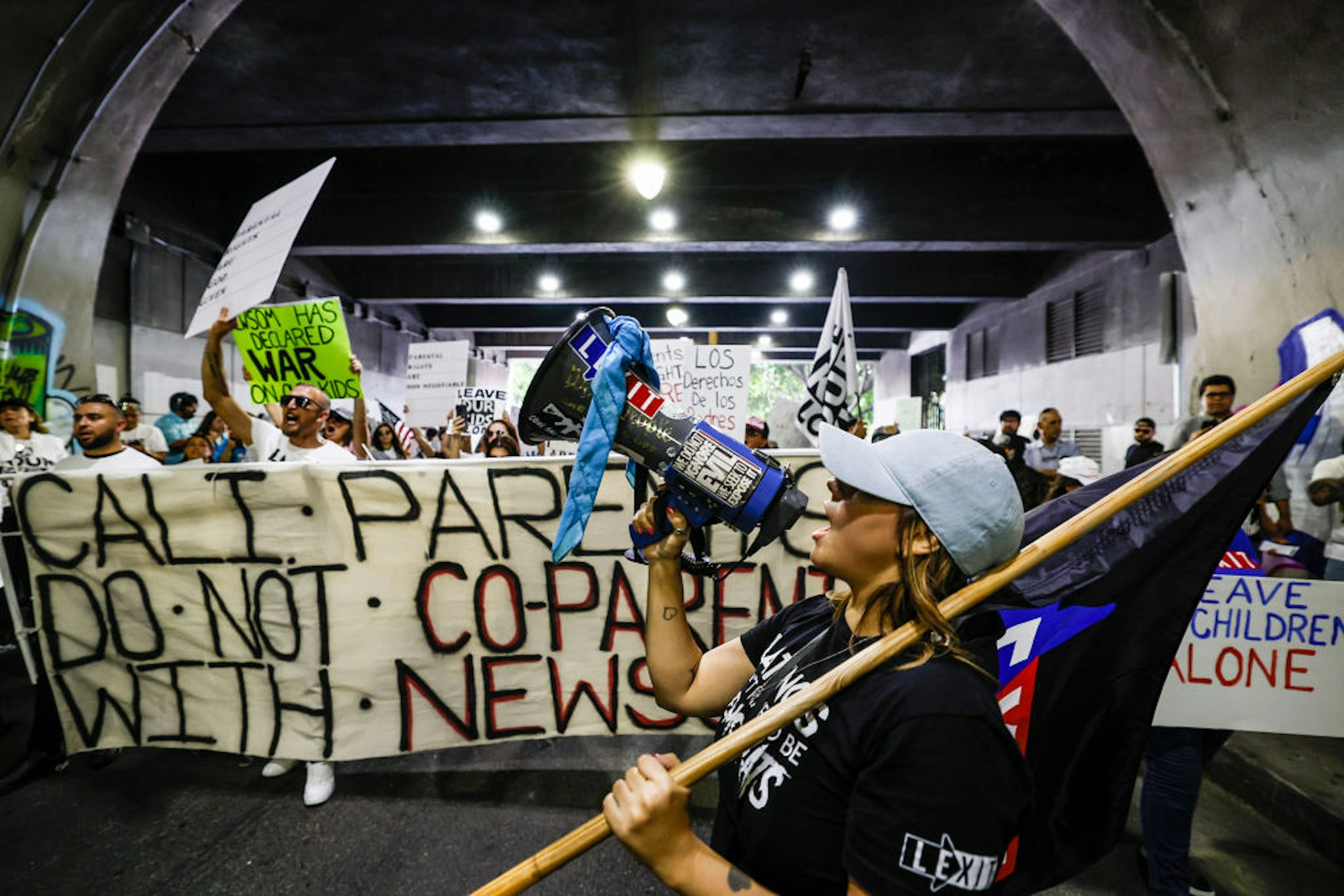 Los Angeles, CA, Tuesday, August 22, 2023 - Parents Rights protesters march under the Third St. Bridge, downtown. About 150 people marched from City Hall to LAUSD headquarters, attracting a small group of lgbtq demonstrators and police. (Robert Gauthier/Los Angeles Times via Getty Images)