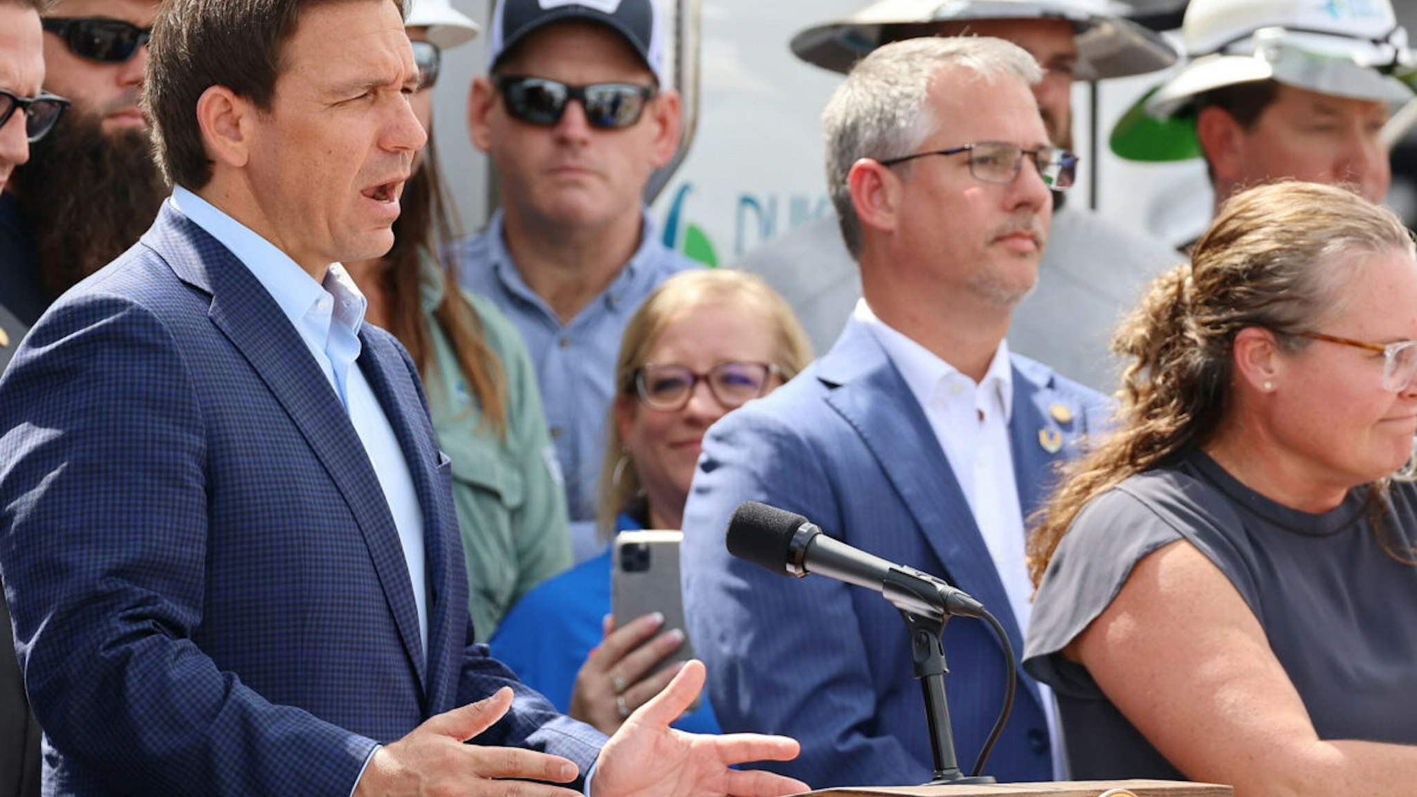 Florida Gov. Ron DeSantis speaks among Duke Energy electrical line technicians during a press conference at Duke Energy's Operations Center in Wildwood, Florida on Tuesday, Aug. 29, 2023.