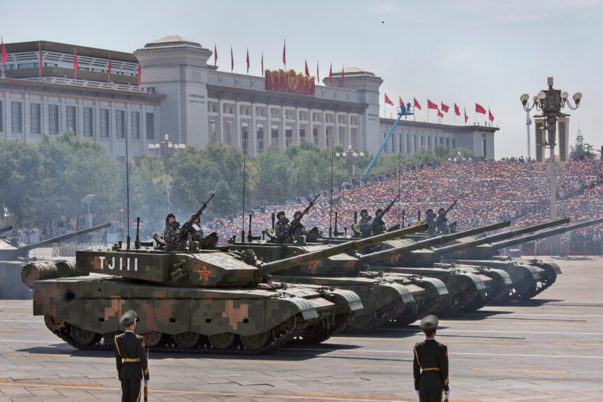 BEIJING, CHINA - SEPTEMBER 03: Chinese soldiers ride in tanks as they pass in front of Tiananmen Square and the Forbidden City during a military parade on September 3, 2015 in Beijing, China. China is marking the 70th anniversary of the end of World War II and its role in defeating Japan with a new national holiday and a military parade in Beijing. (Photo by Kevin Frayer/Getty Images)