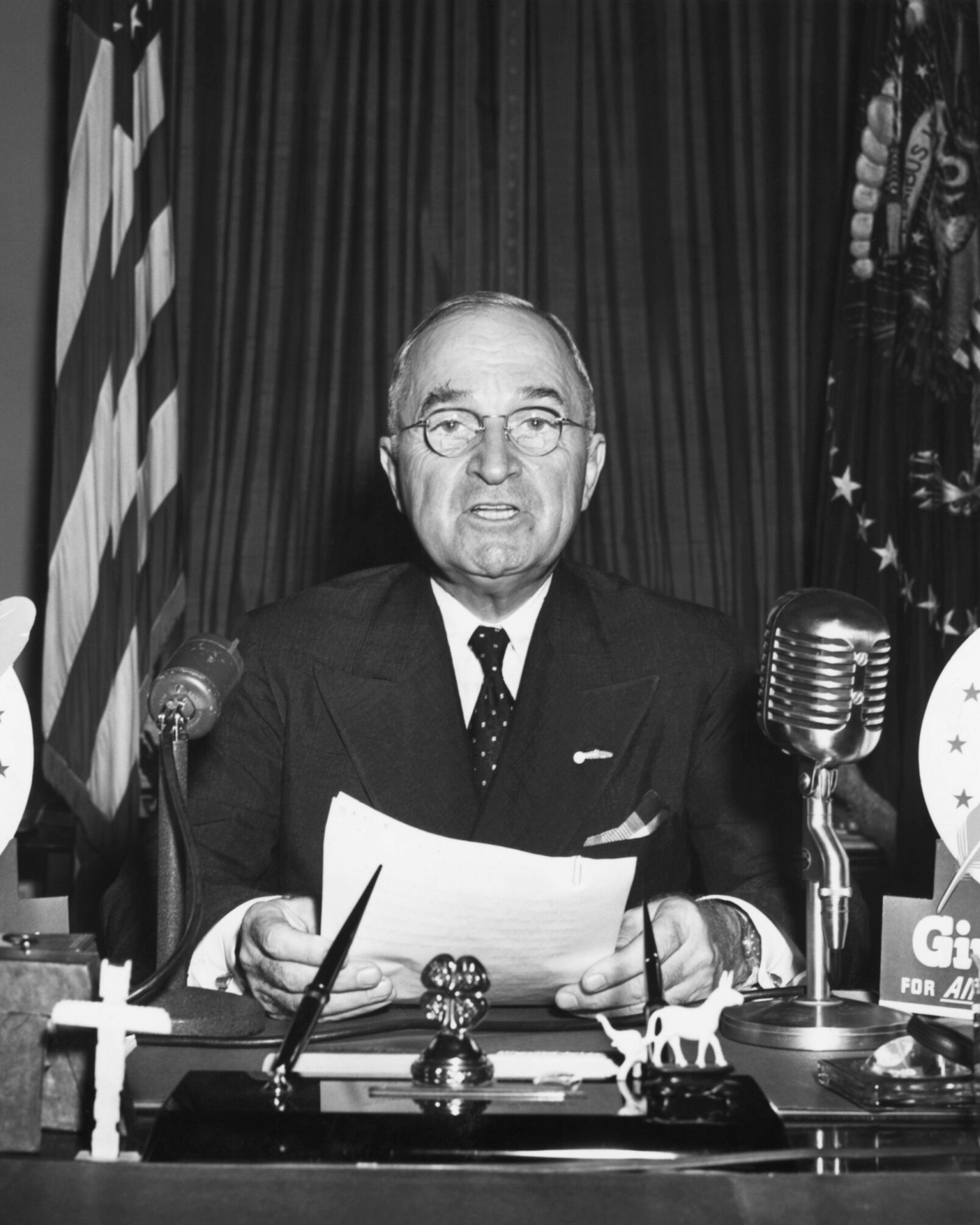 President Harry S. Truman speaks during a television address from the Oval Office.