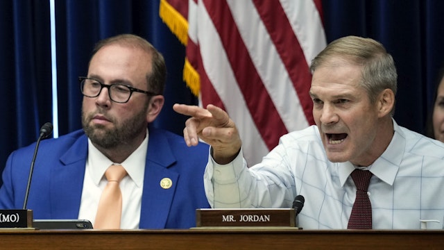 WASHINGTON, DC - JULY 19: (L-R) Committee chairman Rep. James Comer (R-KY) and Rep. Jason Smith (R-MO) look on as Rep. Jim Jordan (R-OH) questions witnesses during a House Oversight Committee hearing related to the Justice Department's investigation of Hunter Biden, on Capitol Hill July 19, 2023 in Washington, DC. The committee heard testimony from two whistleblowers from the Internal Revenue Service who allege that the Hunter Biden criminal probe was mishandled by the Department of Justice.