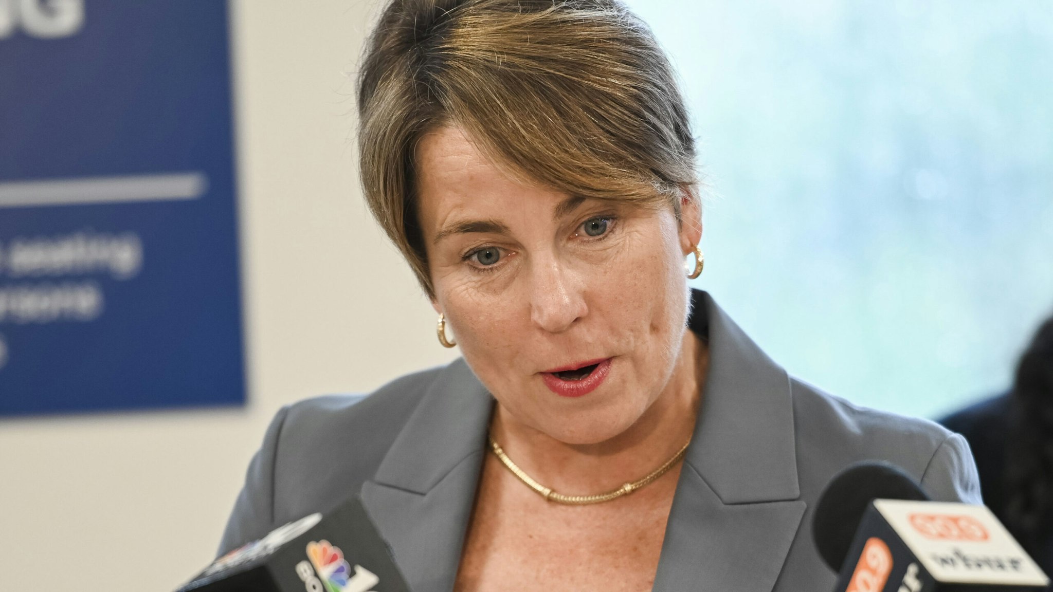 Boston, MA - July 10: Massachusetts Governor Maura Healey speaks to members of the press at a visit and press conference by the Governor at the Haymarket Registry of Motor Vehicles. The RMV is implementing a 2022 law granting access to driver's licenses to eligible undocumented immigrants.