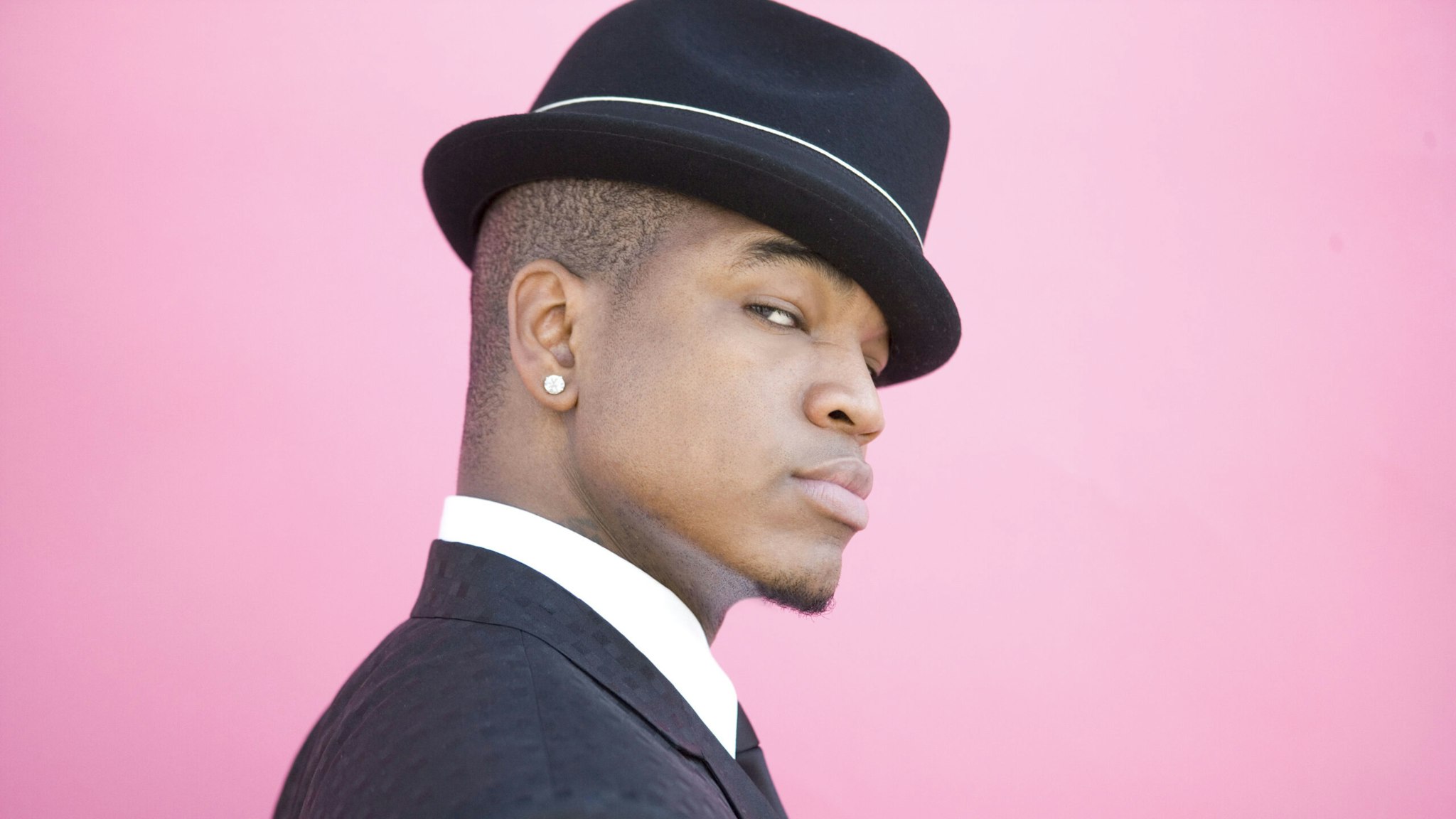 Los Angeles - CIRCA 2008: Ne-Yo poses for a portrait with Susie the chimp in Hollywood, California